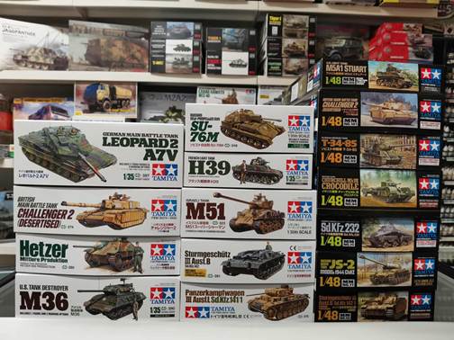 A stack of boxes with pictures of tanks

AI-generated content may be incorrect.