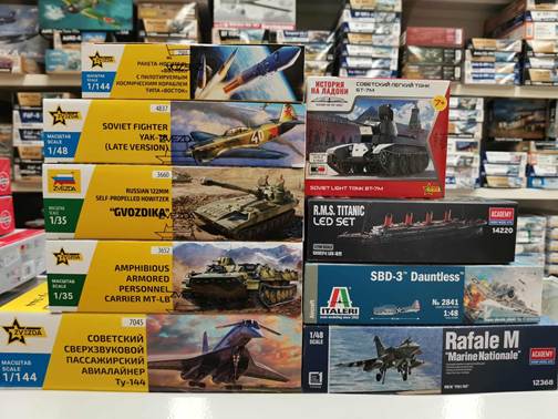 A stack of boxes with pictures of tanks and planes

AI-generated content may be incorrect.